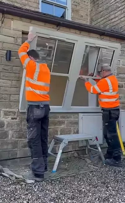 People installing uPVC sash windows